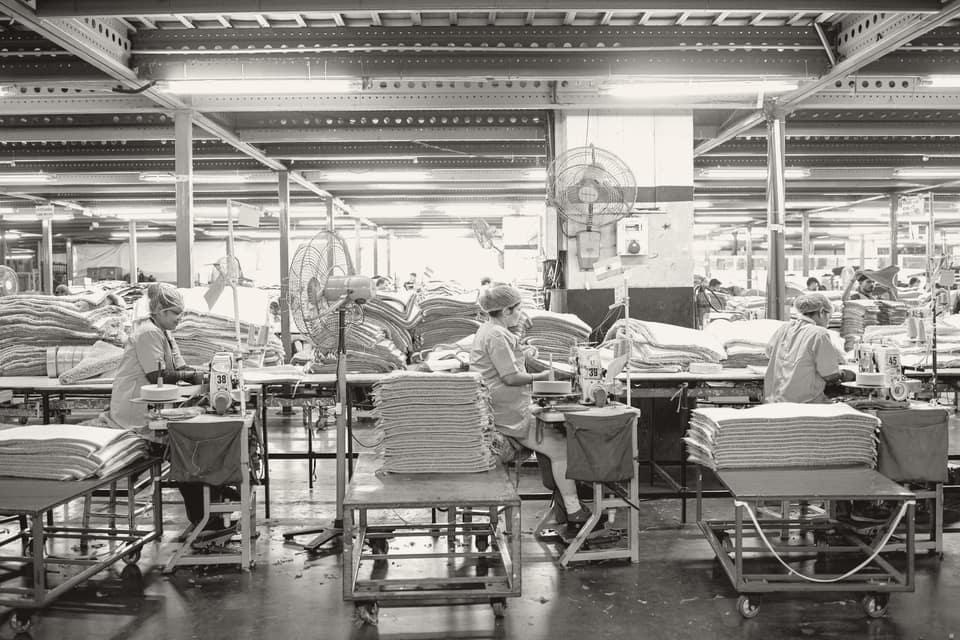 Workers in an industrial textile manufacturing facility; textiles are among the products most often subject to safeguard measures in India.